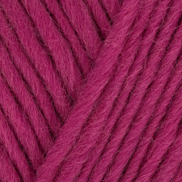 Close-up of pink yarn with a textured pattern