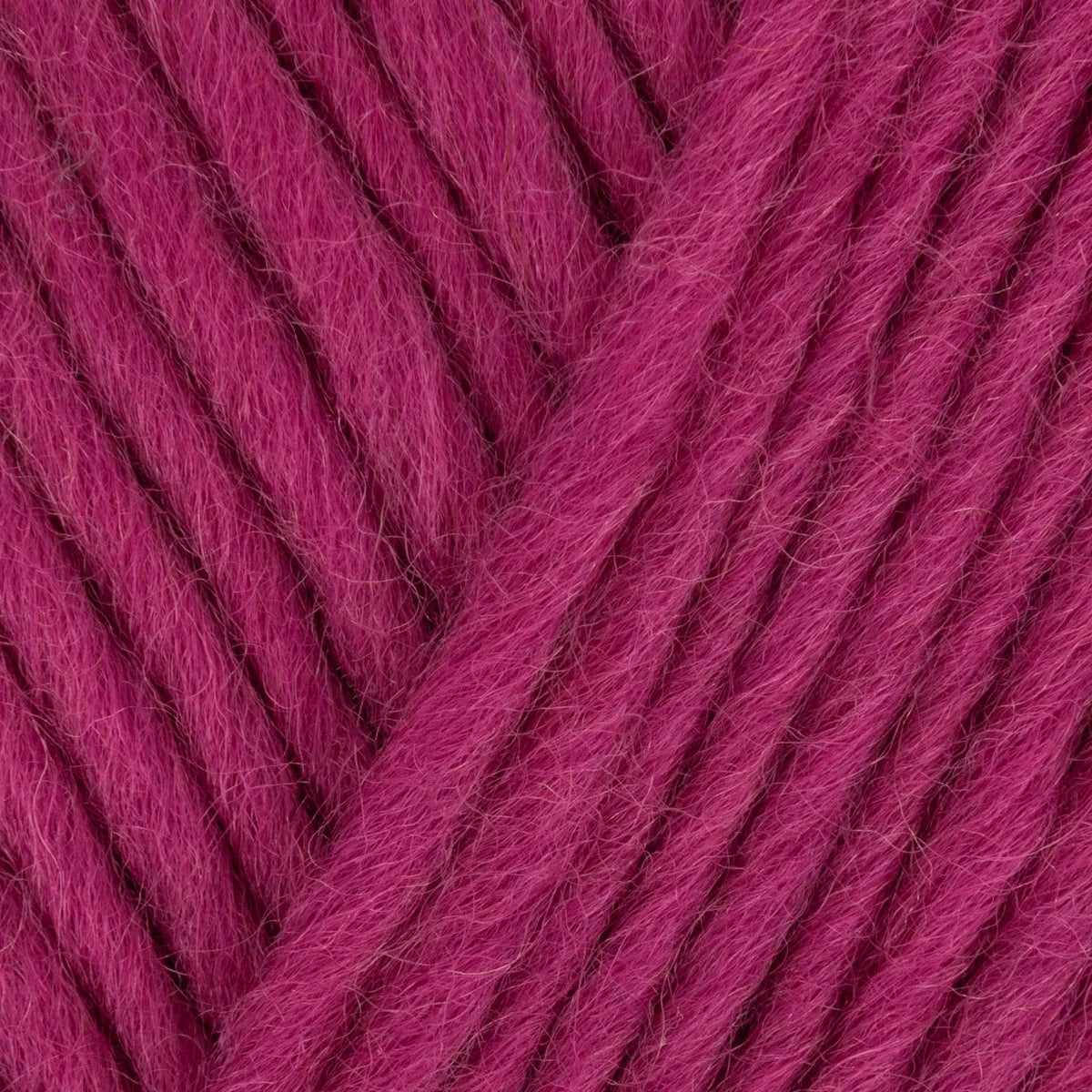 Close-up of pink yarn with a textured pattern
