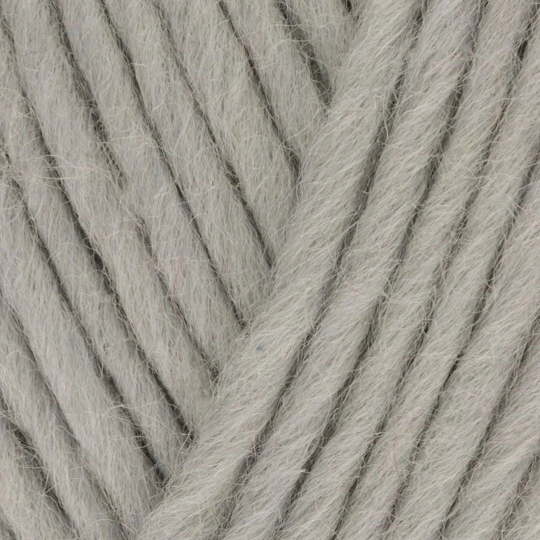 Close-up of gray yarn with visible texture