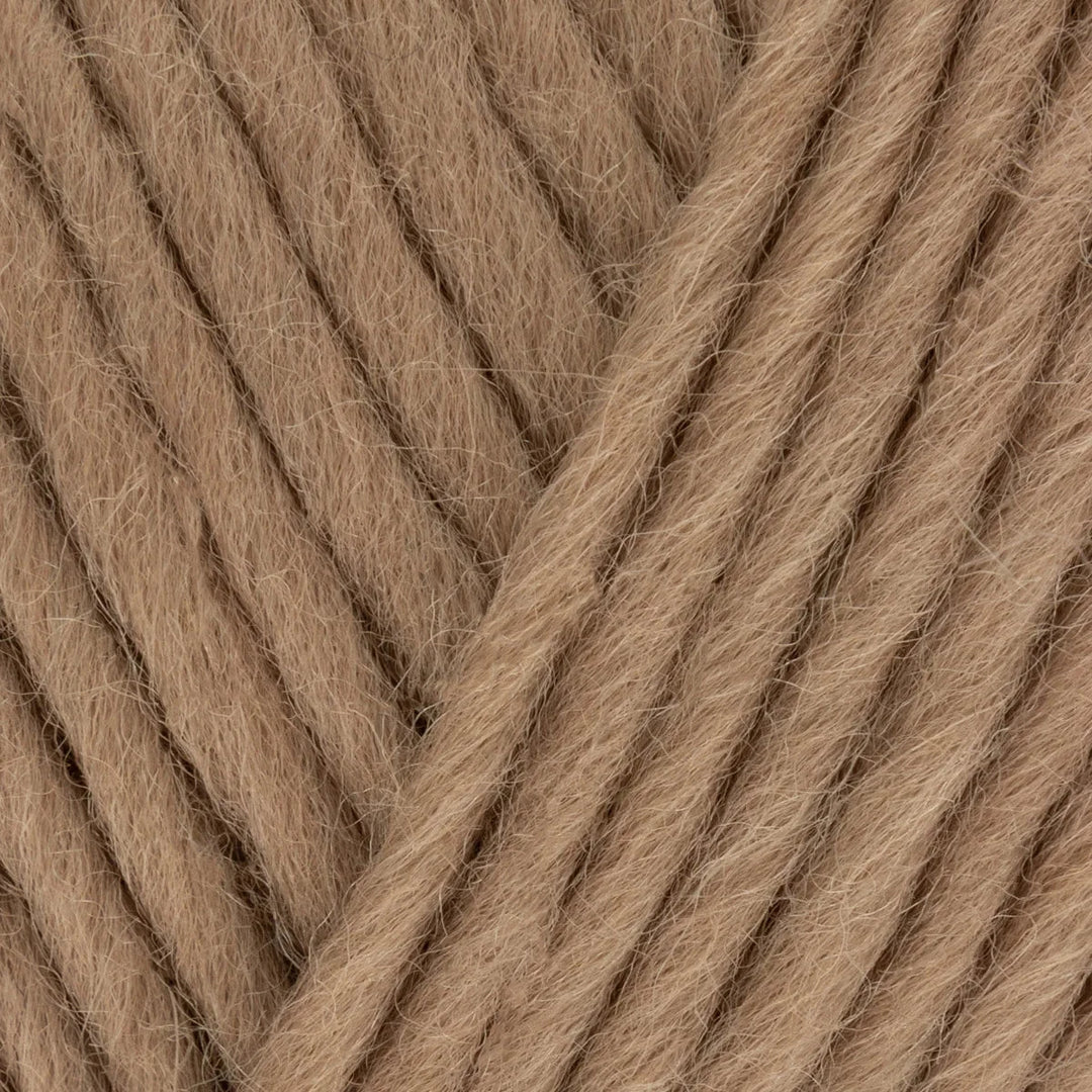 Close-up of brown yarn with a diagonal pattern