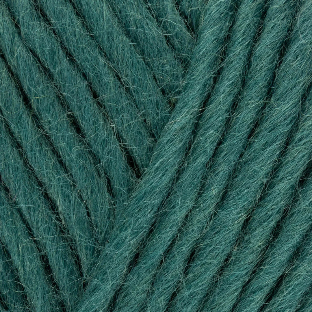 Close-up of teal yarn with visible texture