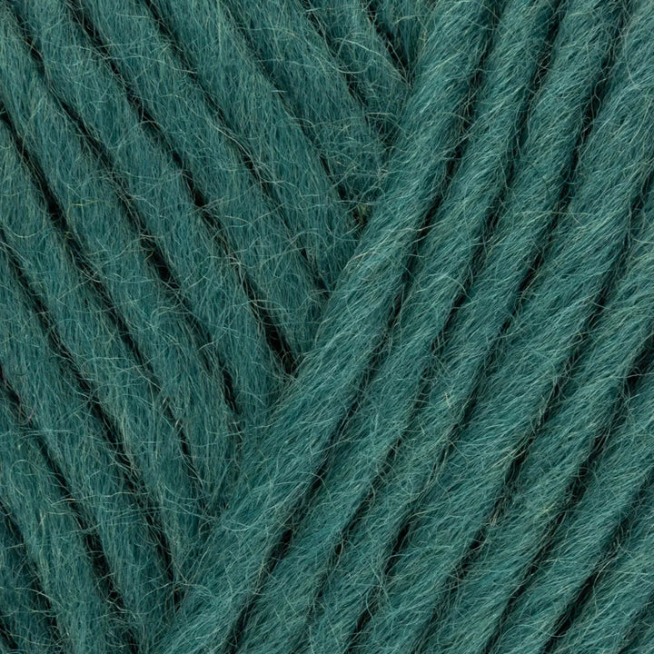 Close-up of teal yarn with visible texture