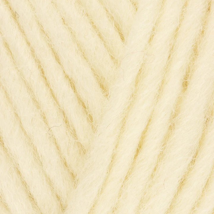 Close-up of beige yarn with a textured pattern