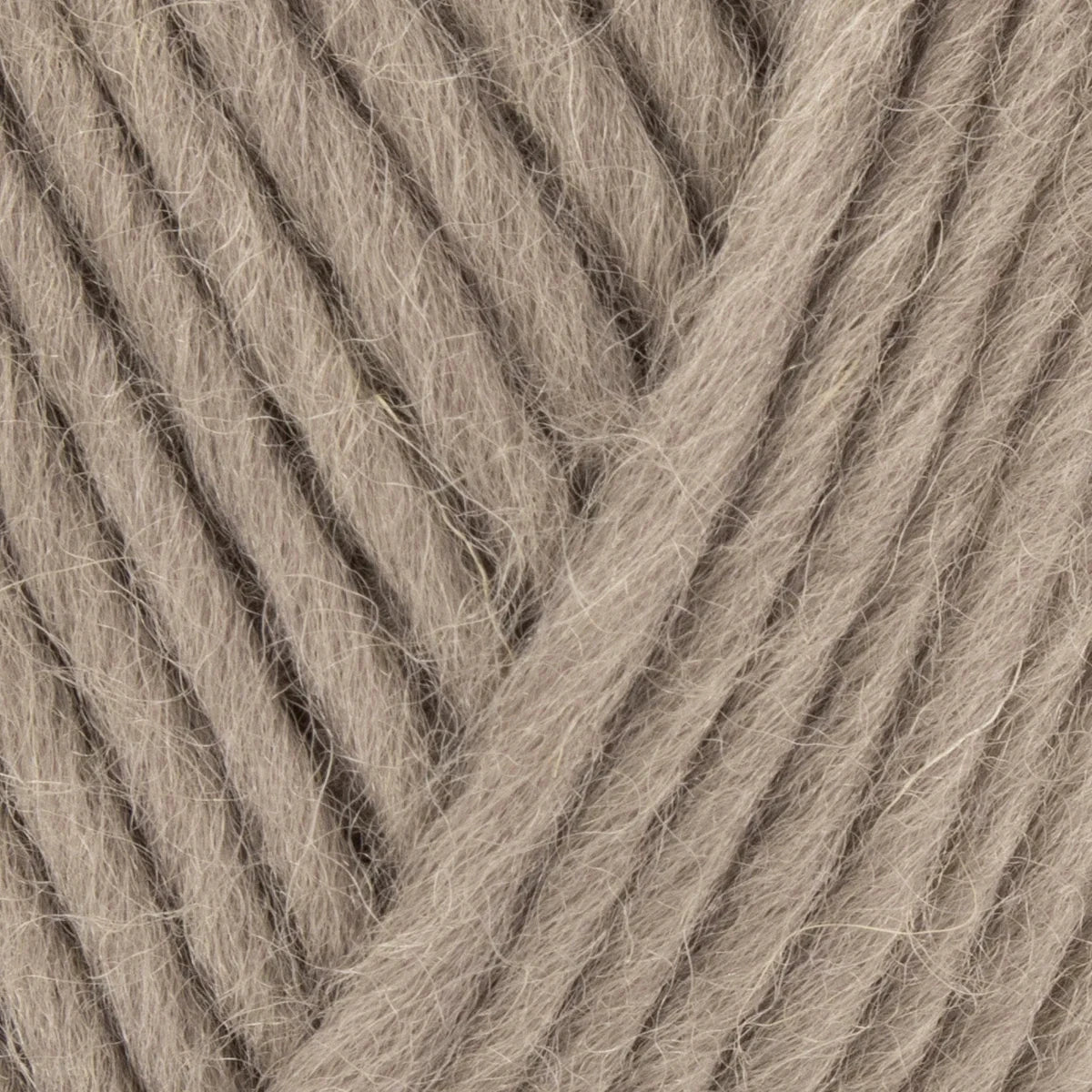 Close-up of beige yarn with visible texture