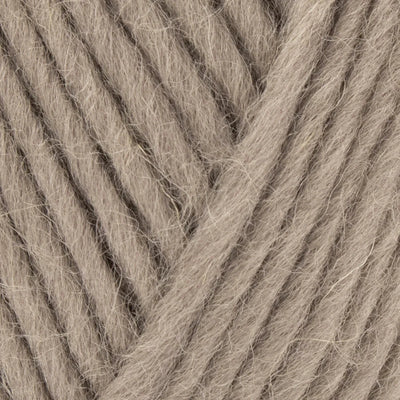Close-up of beige yarn with visible texture