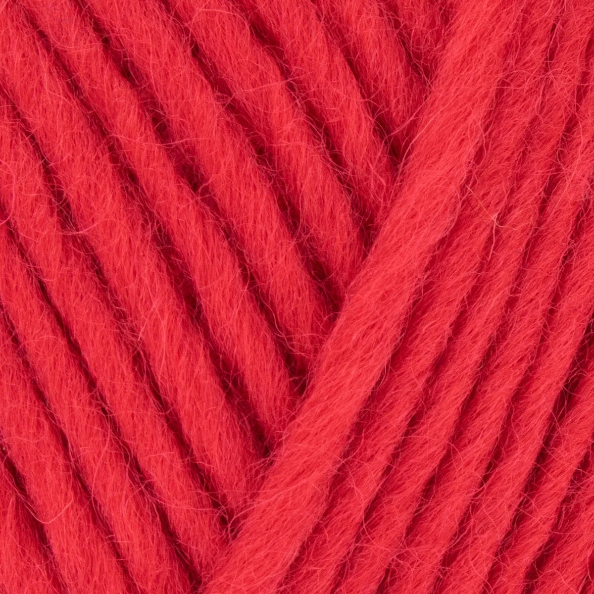 Close-up of red yarn with a textured surface