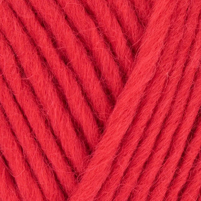 Close-up of red yarn with a textured surface