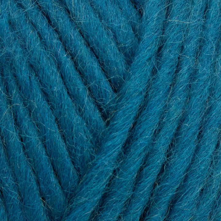 Close-up of blue yarn with a textured surface