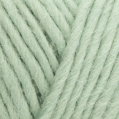 Close-up of light green yarn with a slight texture