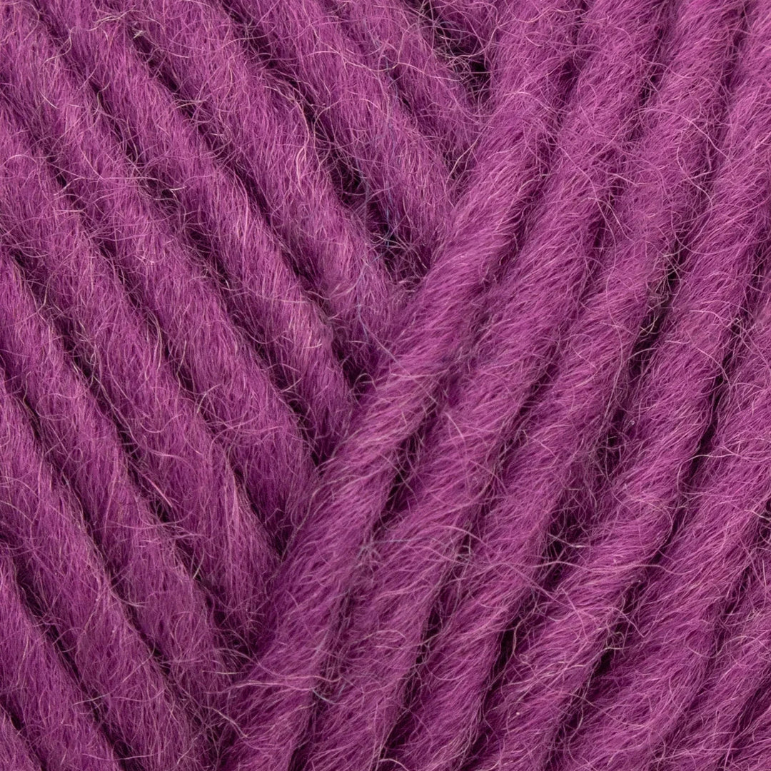 Close-up of purple yarn with a textured surface