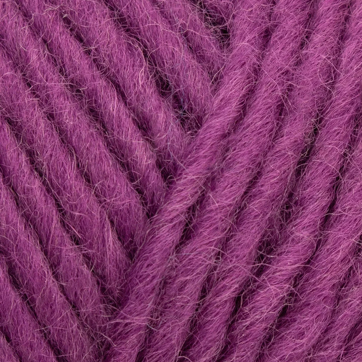 Close-up of purple yarn with a textured surface