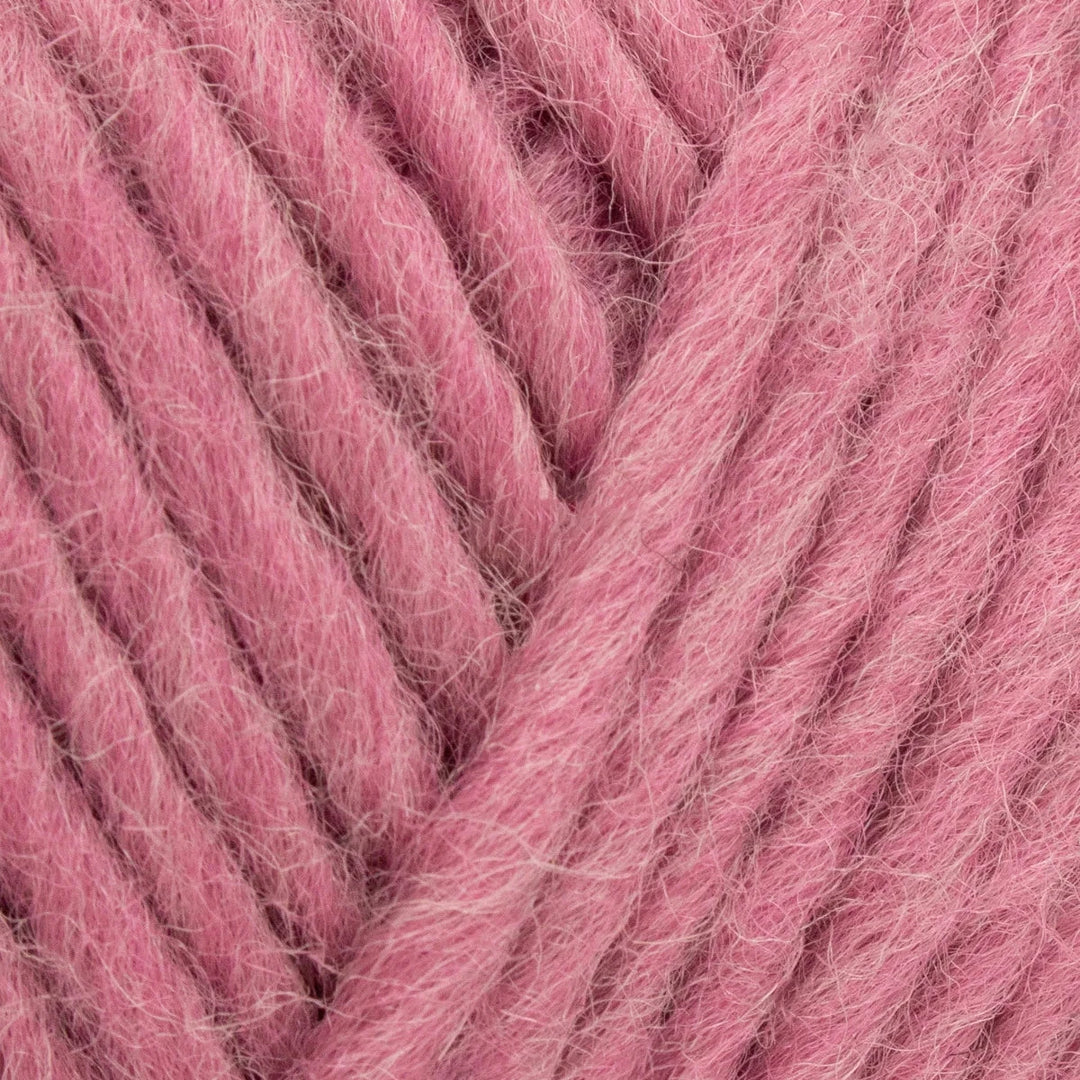 Close-up of pink yarn with visible texture