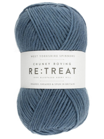 Blue skein of yarn with a label on a white background