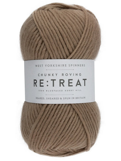 Ball of brown yarn with a label on a white background