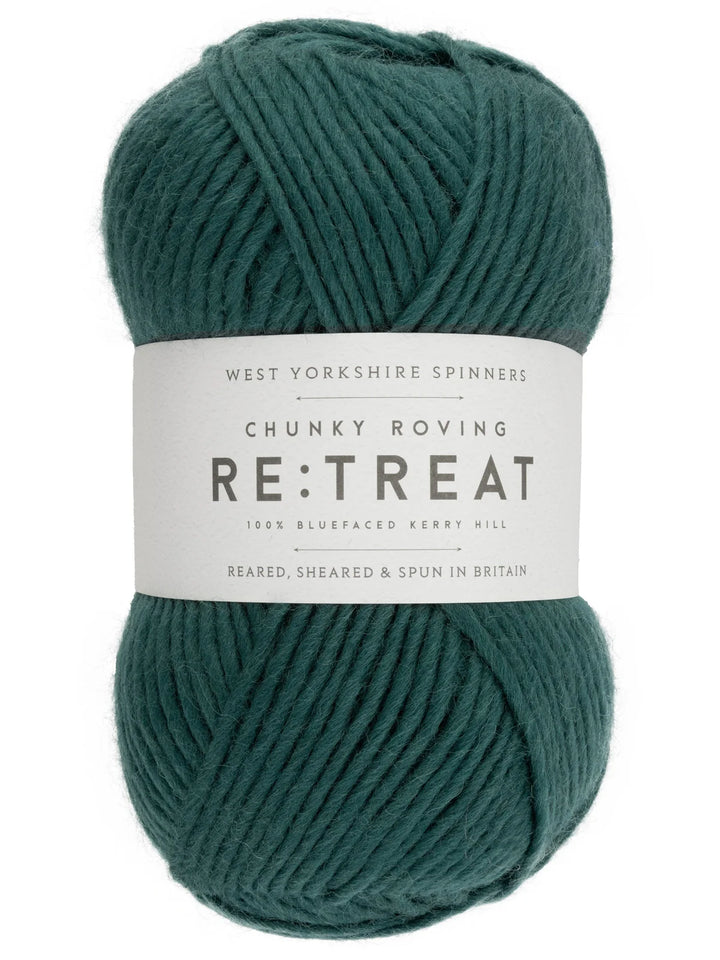 Teal skein of yarn with a label on a white background
